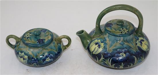 A Moorcroft late Florian tea kettle and cover, and a matching sugar bowl and cover, c.1915, teapot 16.5cm, both with repairs